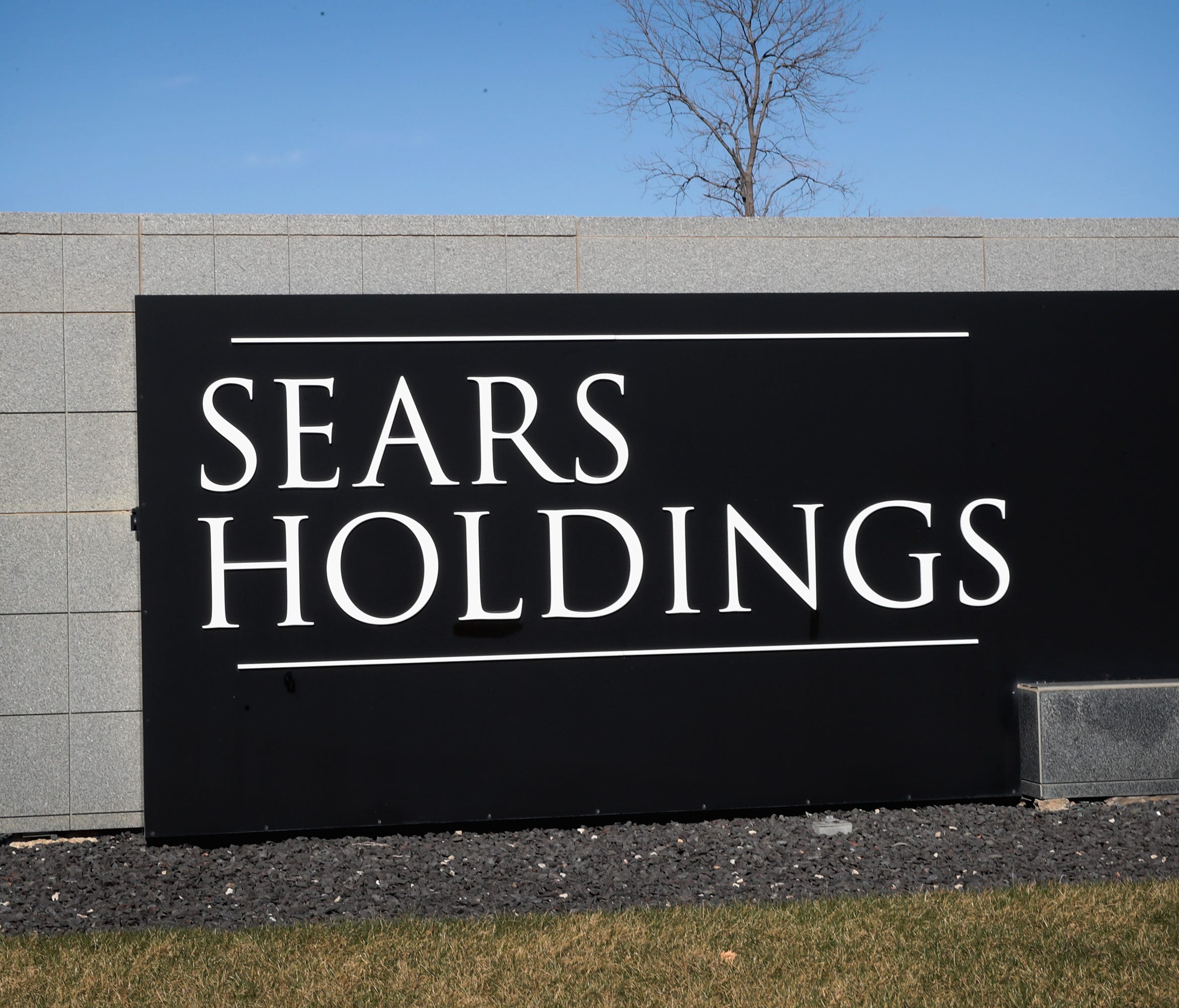 File photo taken in 2017 shows a sign at the edge of the Sears Holdings headquarters campus in Hoffman Estates, Illinois.