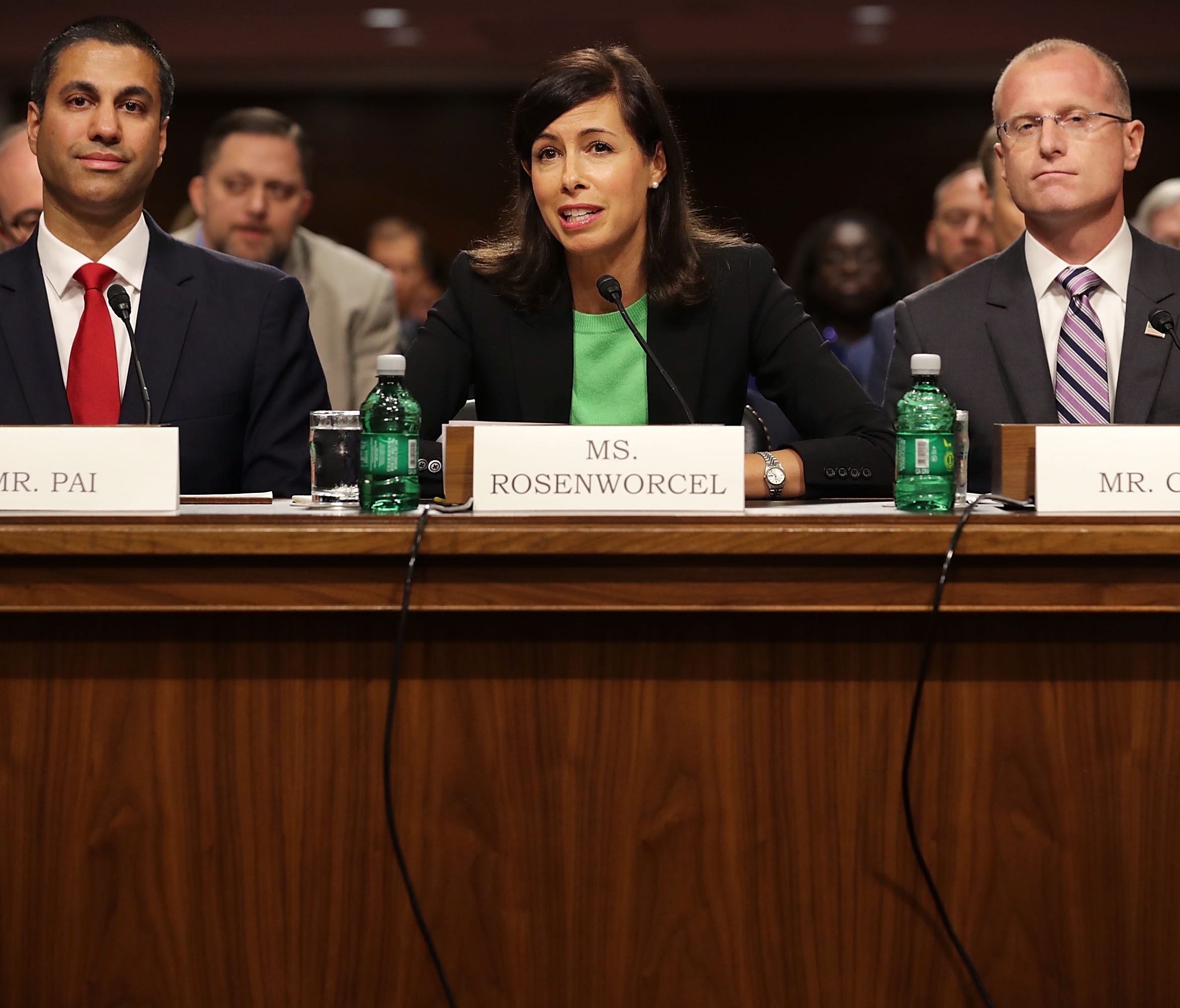 Federal Communications Commission Chairman Ajit Pai and nominees Jessica Rosenworcel and Brendan Carr, left to right, prepare to testify before the Senate Commerce, Science and Transportation Committee during their confirmation hearing July 19, 2017 