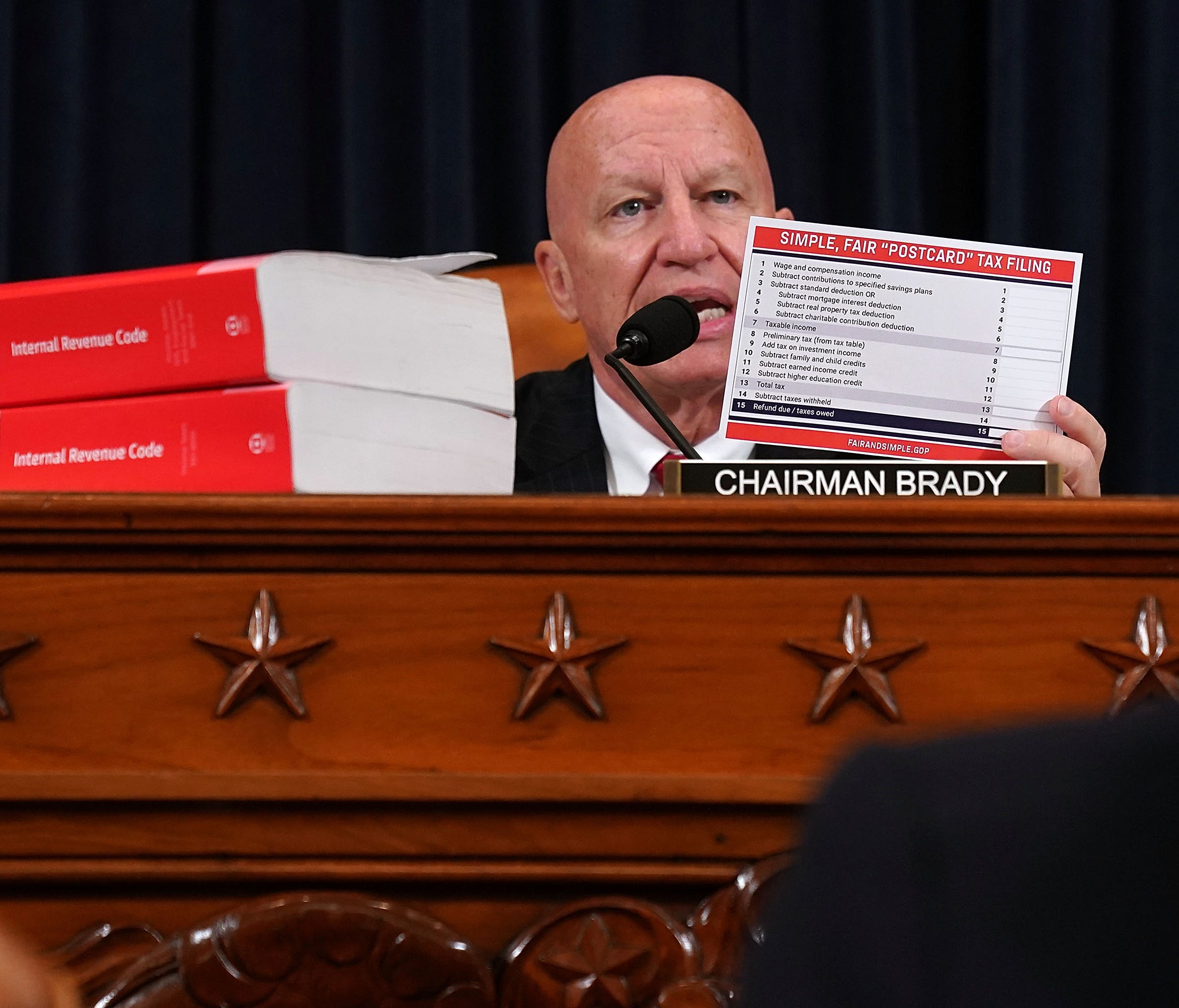 House Ways and Means Chairman Kevin Brady holds up an example of the 