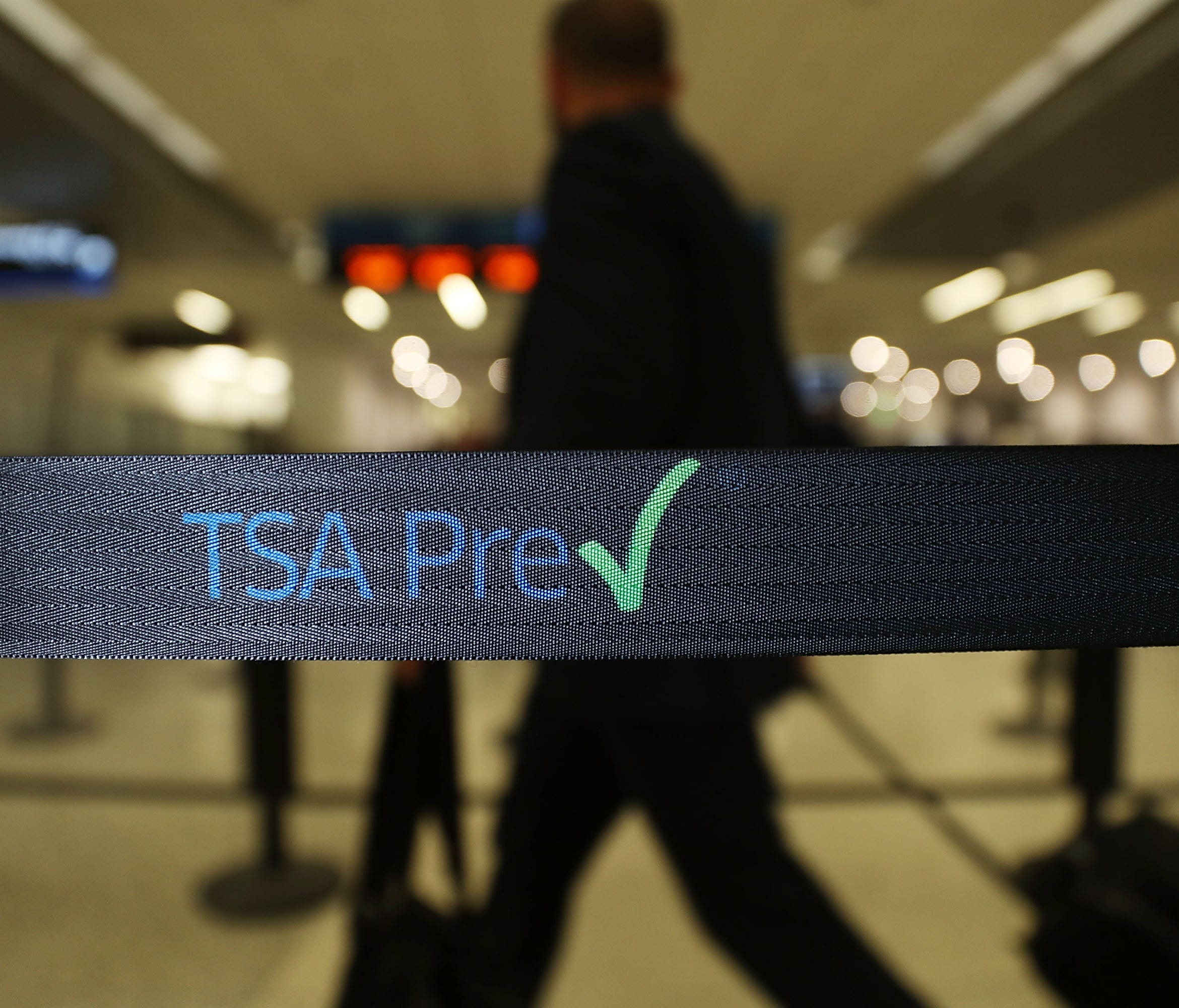 Travelers go through the TSA PreCheck security point at Miami International Airport on June 2, 2016.