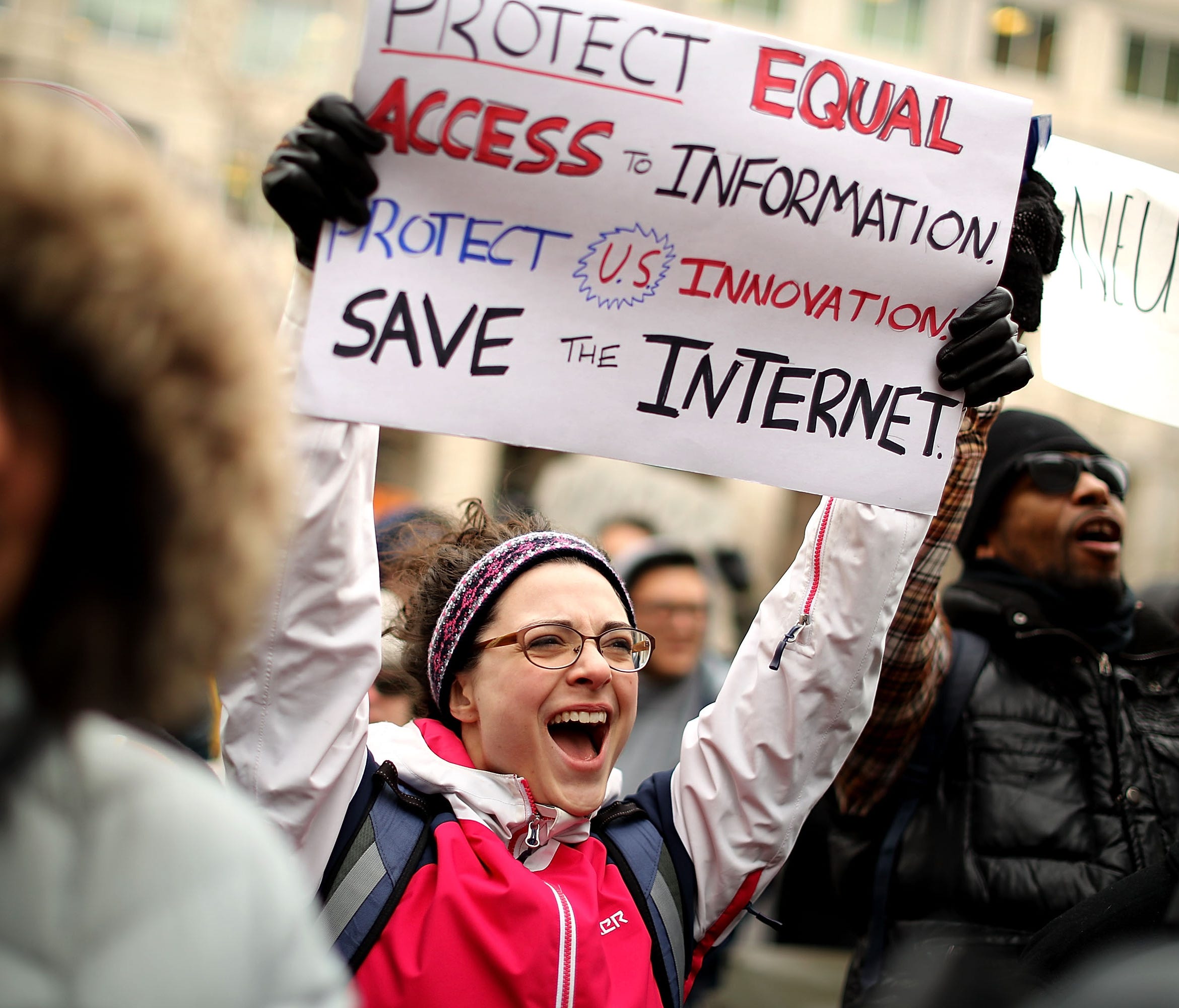 Demonstrators rally outside the Federal Communication Commission building to protest against the end of net nutrality rules Dec. 14, 2017 in Washington, DC.