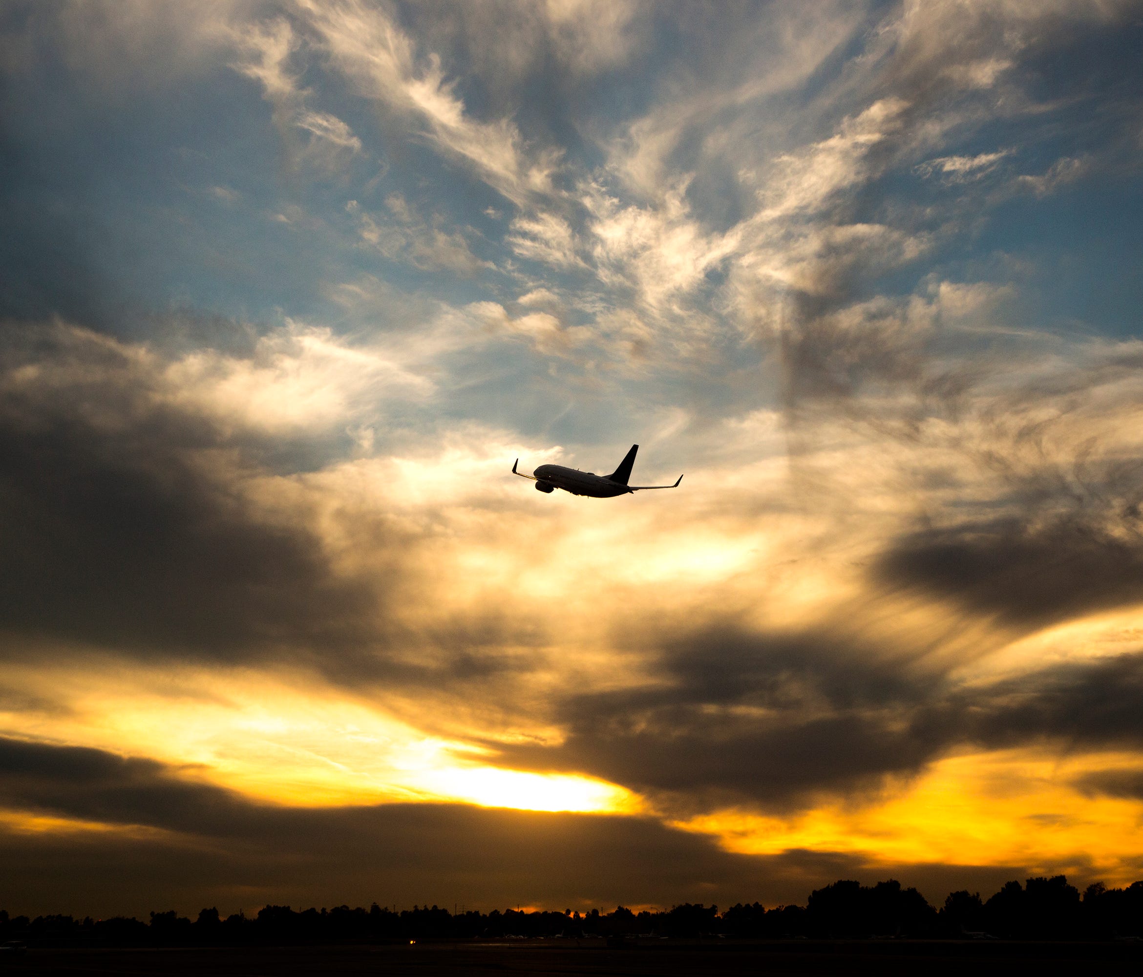 A plane takes off at John Wayne Airport in Orange County, Calif.
