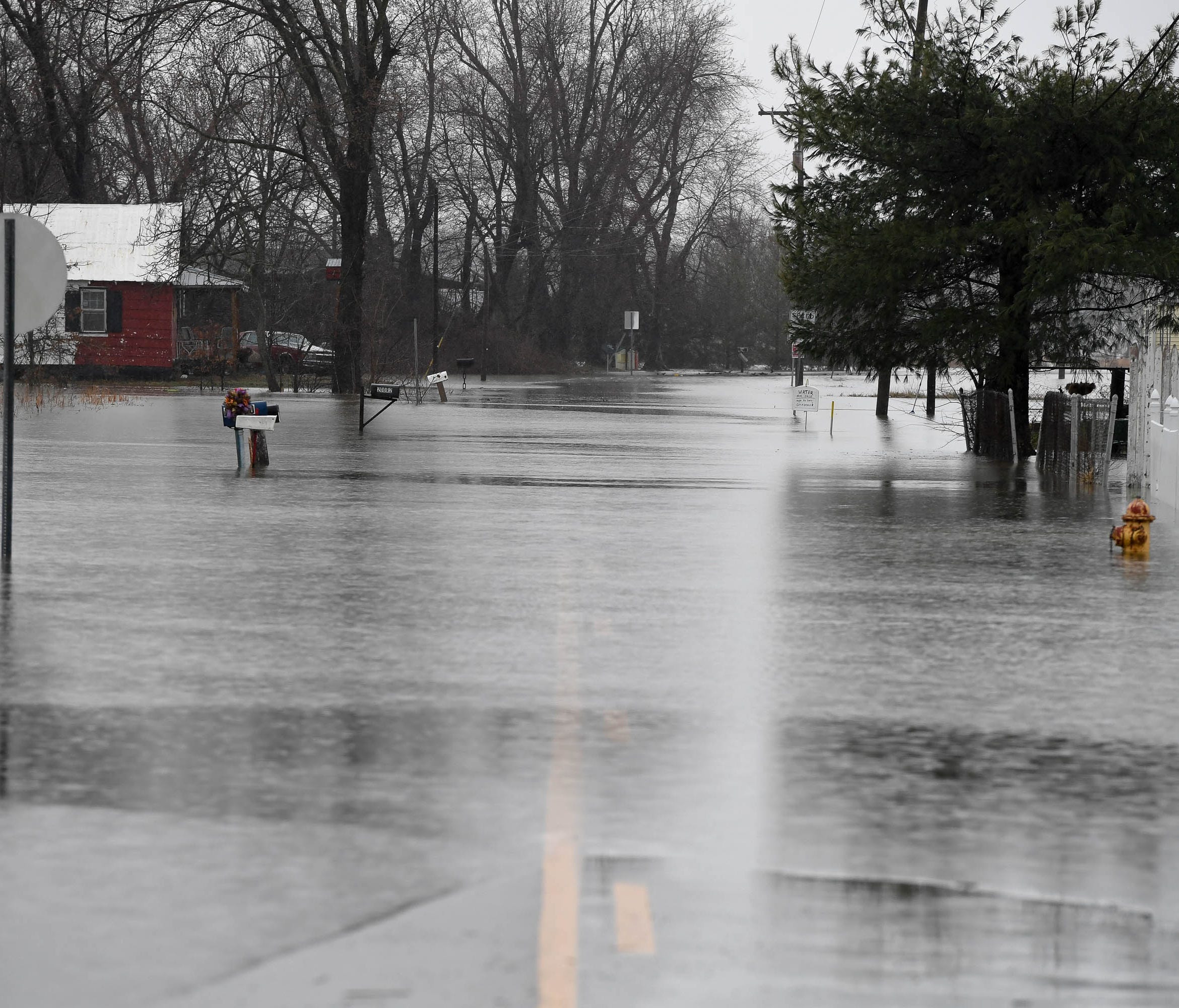 Highway 811 in Beals, Ky. was dry on Friday is under water on Saturday as river waters continue to rise in the Tri-State area Saturday. Flooding is expected to get worse as afternoon storms are expected to bring wind, some flash flooding and a chance
