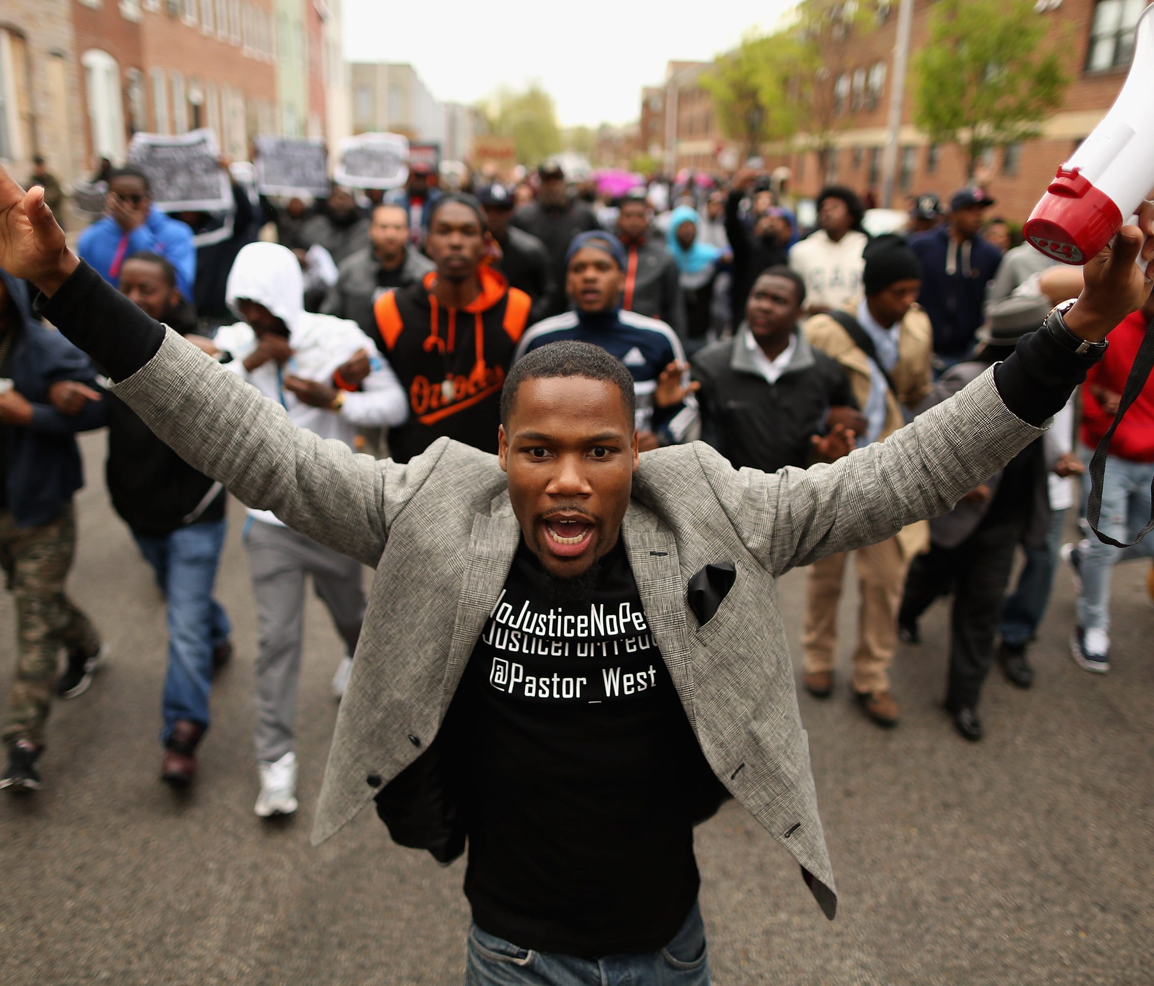 Hundreds of demonstrators march toward the  Baltimore Police Western District station during a protest against police brutality and the death of Freddie Gray in 2015.