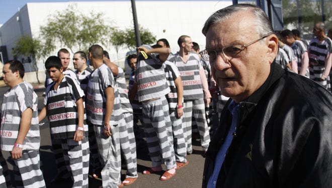 Maricopa County Sheriff Joe Arpaio watches inmates at his Tent City Jail in an undated photo. The county had considered closing the jail, a longtime pet project for Arpaio, to cut costs.