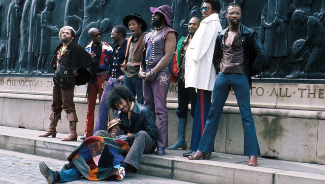 Parliament-Funkadelic in 1971 in Liverpool: Pictured from left to right are vocalist Fuzzy Haskins, guitarist Tawl Ross, keyboardist Bernie Worrell, drummer Tiki Fulwood, vocalist Grady Thomas, founder George Clinton, vocalist Ray Davis, vocalist Calvin Simon and, seated, guitarist Eddie Hazel and bassist Billy Nelson.