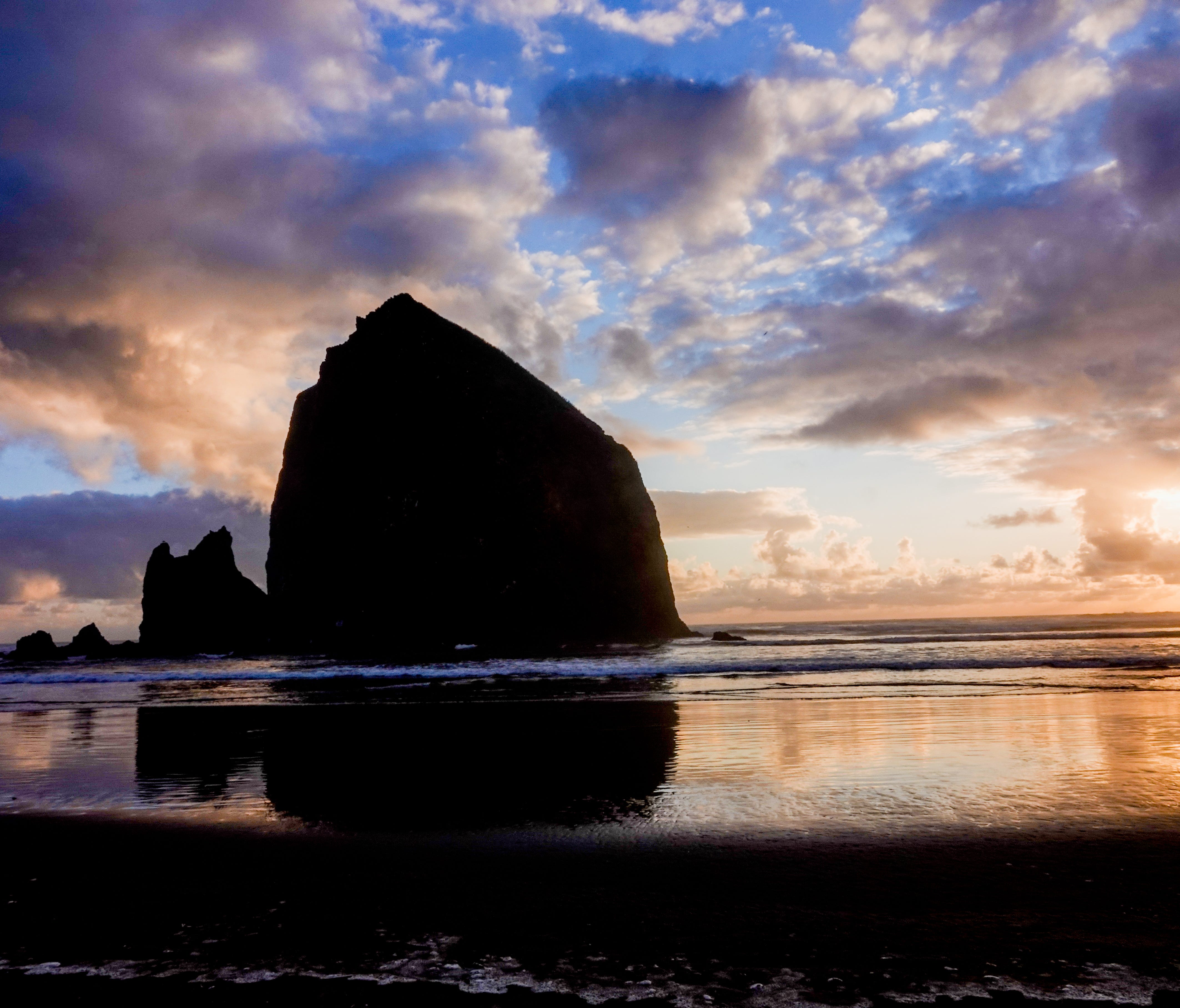 Sunset in Cannon Beach. Photo geek note: this is an HDR photo, three photos merged into one, a combination of under-exposed, over-exposed and one normal exposure