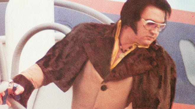 This positively terrible Elvis Presley overcoat and fur capelet could