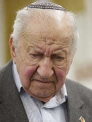 Holocaust survivor Martin Lowenberg pauses as he recounts