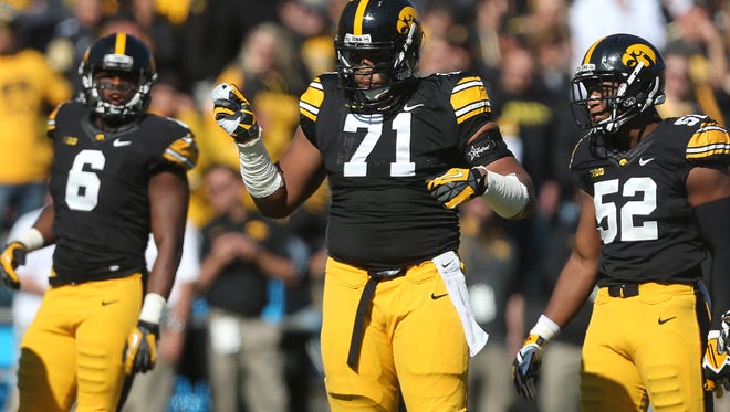 Iowa left tackle Carl Davis dances along to a Jay Z song during a break in action against Indiana on Saturday, Oct. 11, 2014, at Kinnick Stadium in Iowa City, Iowa.
