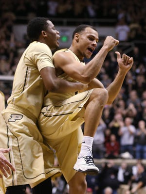 Purdue Boilermakers forward Basil Smotherman and teammate Bryson Scott celebrate Purdue's double digit lead over Indiana in the first half. Purdue hosted Indiana at Mackey Arena Wednesday, January 28, 2015.