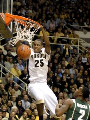 JaJuan Johnson dunks the ball as Michigan State's Raymor Morgan looks on during the Boilermakers 72-54 victory on Tuesday, February 17, 2009.