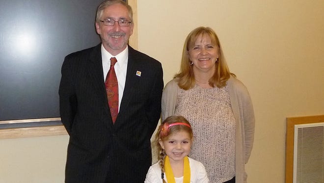 Julianne Guinup, a first-grader at Durand Elementary School in Vineland, was the winner for first graders at the school for the New Jersey Agricultural Society’s annual Farm-City Week Poster Contest. She is pictured with Jerry Verrico, president of the New Jersey Agricultural Society, and Carolyn Taylor, director of Learning Through Gardening.