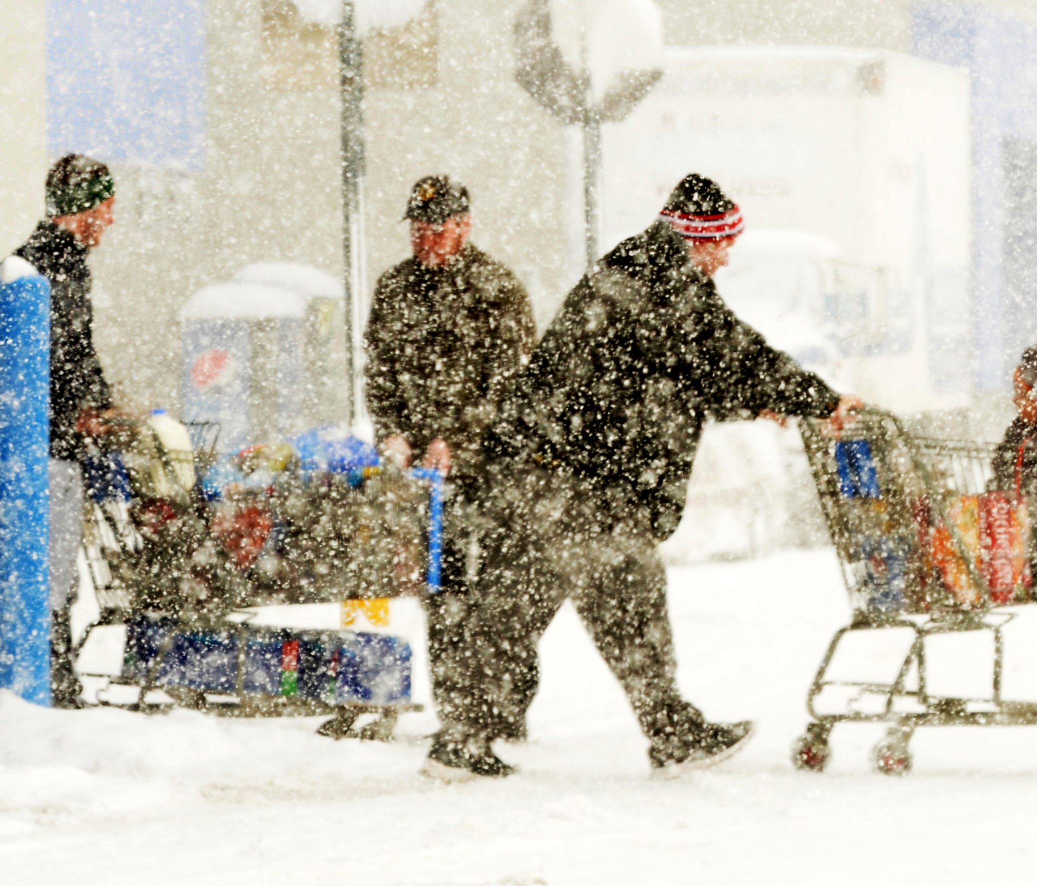 Shoppers brave the snow at Walmart in Ashtabula Township, Ohio, on Tuesday, Dec. 26, 2017.