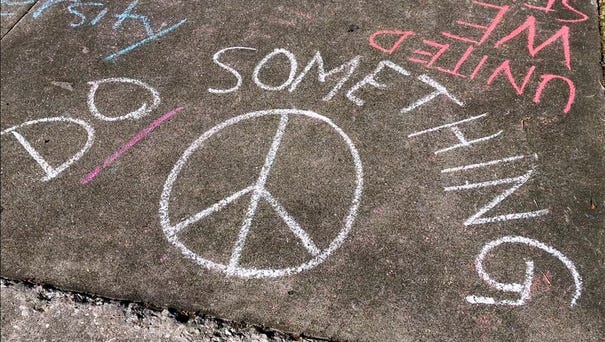 Sidewalk messages written by Plant High School...