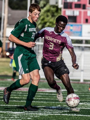 Licking Heights senior Yemi Ogunji fights to keep possession against Northridge during the Licking County Preview at White Field in August.