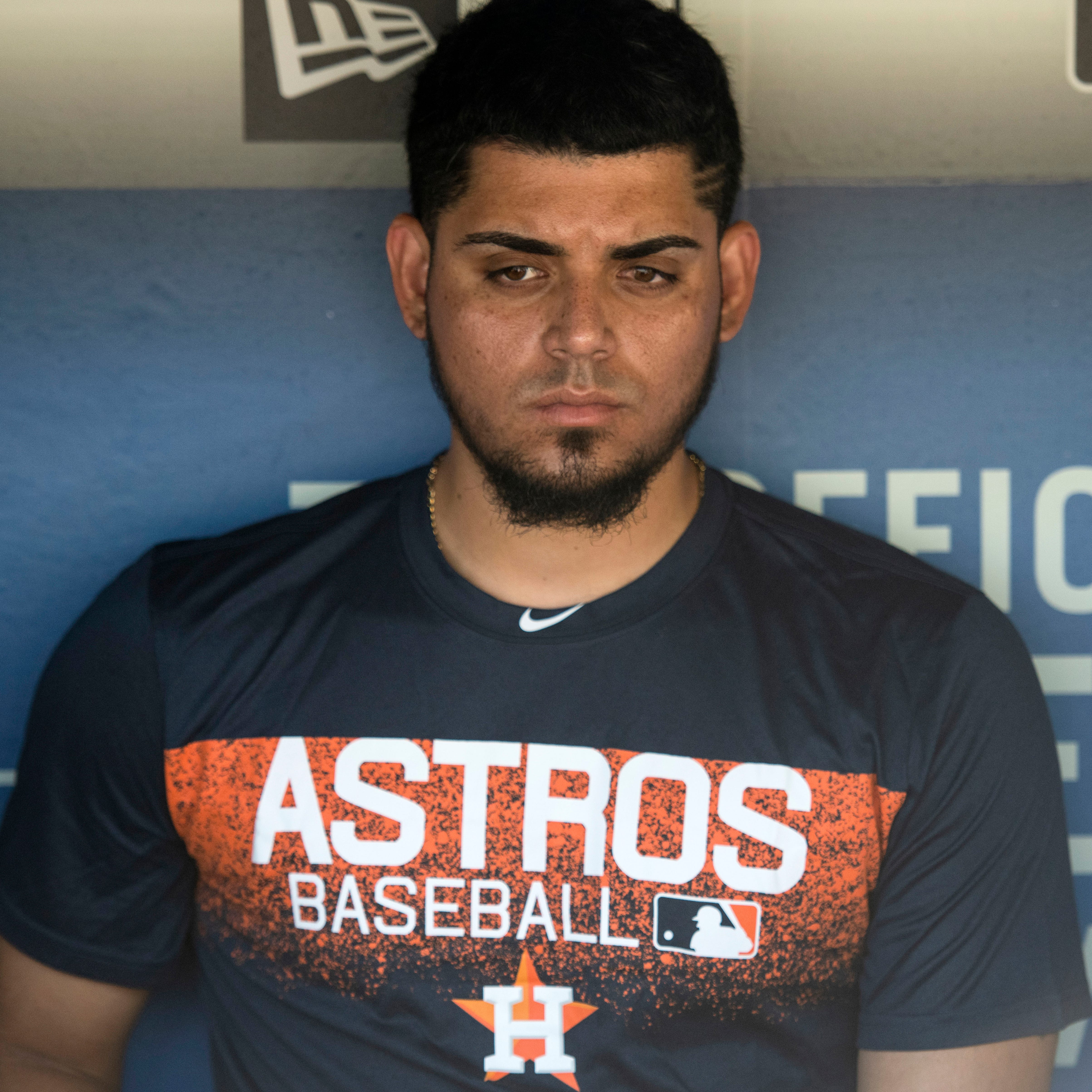 Houston Astros relief pitcher Roberto Osuna is interviewed in the dugout before a game against the Los Angeles Dodgers on Sunday.