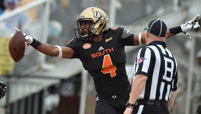 South squad wide receiver Tre'Quan Smith of Central Florida (4) celebrates after catching a pass for touchdown against the North squad during the first quarter of the 2018 Senior Bowl at Ladd-Peebles Stadium.