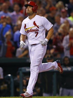Matt Holliday of the Cardinals rounds the bases after hitting a home run during the seventh inning against the Pirates on Friday.