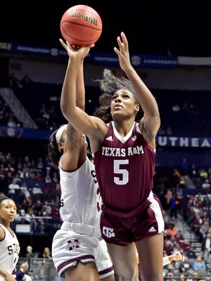 Texas A&M Aggies forward Anriel Howard (5) shoots the ball against Mississippi State Lady Bulldogs guard Myah Taylor (3) during the first half of a semi final game at Bridgestone Arena. Mandatory Credit: Jim Brown-USA TODAY Sport