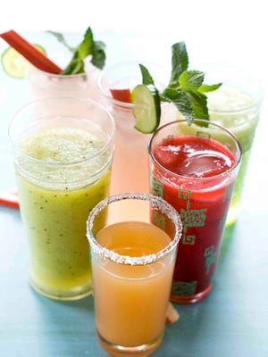 
From left clockwise: Green Granny Slush, Cucumber Rhubarb Mojito, Raspberry Daiquiri and Ruby Rita drinks. 
