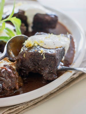 Red wine braised slow cooker short ribs. Browning the meat and vegetables will require some time in the skillet beforehand.