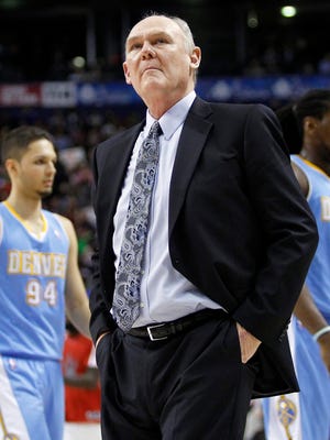 George Karl is in discussions to become the Kings' next coach.