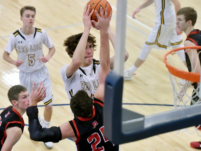 Red Lion's Brock Gould shoots against Hempfield's Bryan