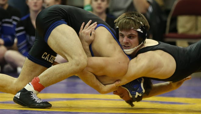 Caleb Coleman of Bondurant-Farrar, right, wrestles with Tyler Thomas of Crewstwood during the 145 pound Class 2-A semifinals on Friday, Feb. 20, 2015, at Wells Fargo Arena in Des Moines, Iowa.