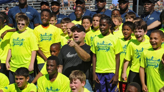 The Garth Brooks Teammates for Kids Foundation and ProCamps have a 13-year history of impacting kids across the nation. On Saturday, Oct. 18, 2014, country music star Brooks joined the coaches and kids at the Teammates ProCamp football camp at Robert E. Lee High School in Jacksonville, Fla., to work on football skills and teamwork.