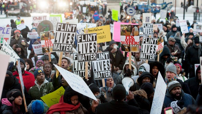 Flint water crisis protesters gather outside of the Michigan State Capitol in January 2016. So far, more than 33,450 people have filed a claim or intend to bring a claim in a $600 million civil settlement of about 100 lawsuits, according to Attorney General Dana Nessel's office. But the number is expected to grow as people figure out whether they qualify for claims.