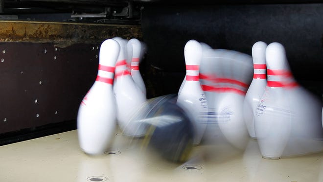 GUADALAJARA, MEXICO - OCTOBER 25:  A bowling ball hits pins at the Tapatio Bowling Alley  during Day 11 of the XVI Pan American Gameson October 25, 2011 in Guadalajara, Mexico.  (Photo by Mike Ehrmann/Getty Images)