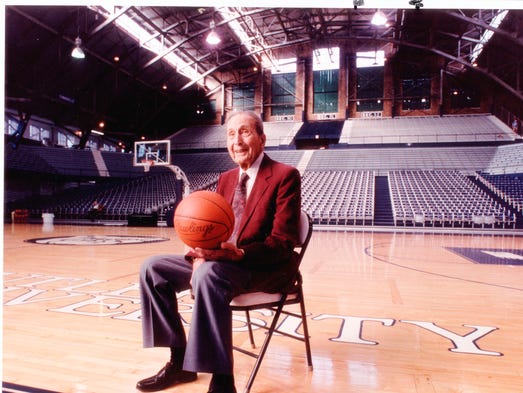 Tony Hinkle sits in Hinkle Fieldhouse named in his