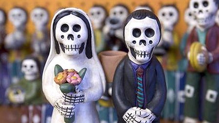 Skeleton figurines are one of the many Dia de Los Muertos products that can be found at Suenos Latin American Imports at 4200 N. 7th Ave.