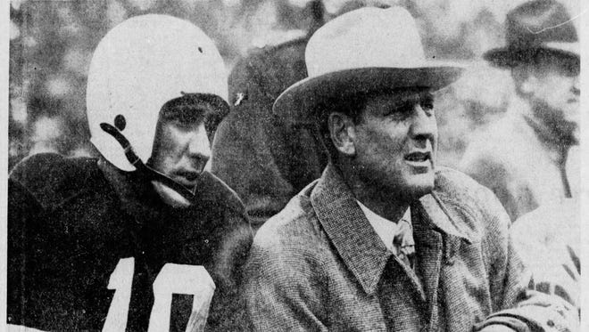 A photo from the Sept. 3, 1975 edition of the Courier-Journal showed former UK quarterback Babe Parilli and coach Bear Bryant watching a 1952 bowl game together.