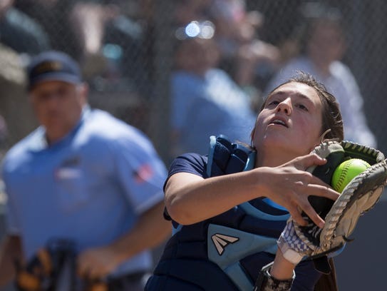 IHA’s Mia Recenello pulls in a pop-up during late innings
