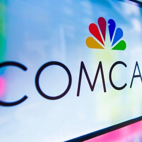 Comcast logo featuring the NBC peacock logo.