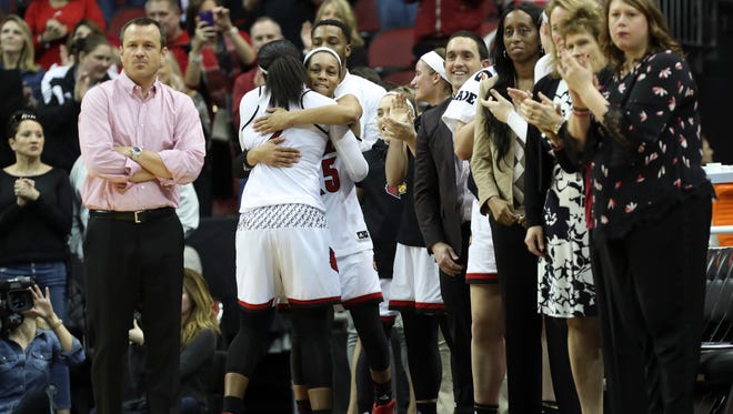 U of L’s Asia Durr (25) hugs senior Myisha Hines-Allen (2) after their win against Pittsburgh on Senior Day at the Yum Center.    Feb. 25, 2018