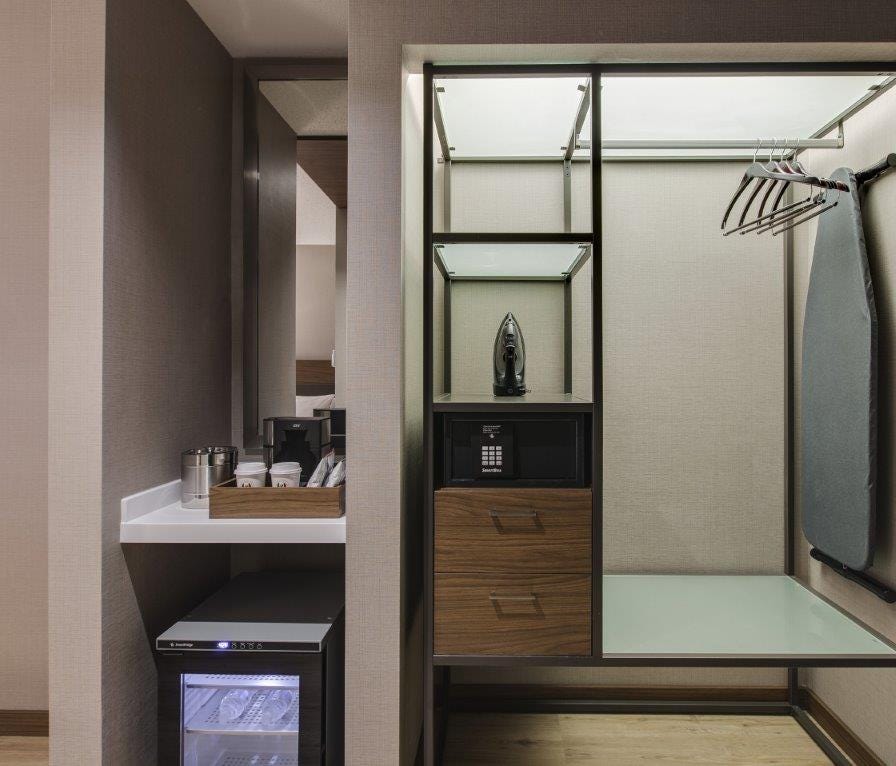 AC Hotels, a brand of Marriott International, are moving towards open closets as a way to maximize space in smaller rooms.