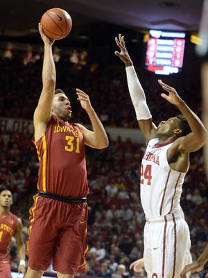 Iowa State Cyclones forward Georges Niang (31) attempts to shoot over Oklahoma Sooners guard Buddy Hield (24) during the first half at Lloyd Noble Center.
