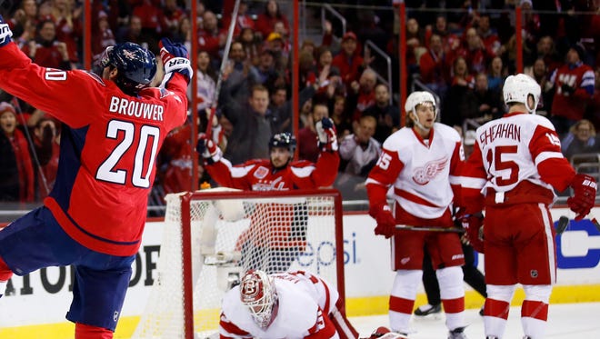 Washington Capitals right wing Troy Brouwer (20) celebrates after his goal past Detroit Red Wings goalie Jimmy Howard (35) in the first period of an NHL hockey game, Saturday, Jan. 10, 2015, in Washington.