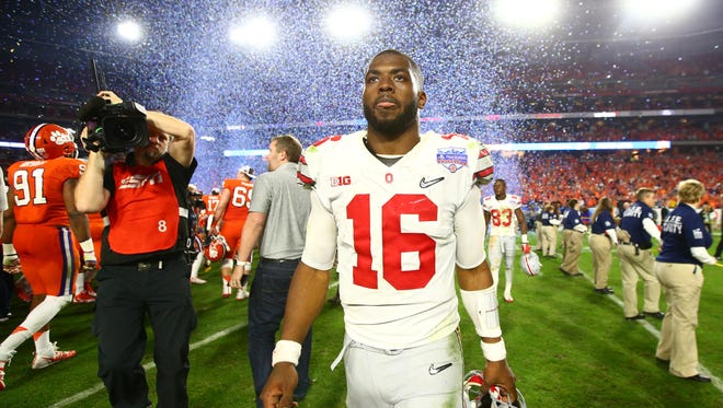 Ohio State quarterback J.T. Barrett leaves the field after the 31-0 loss to Clemson in the Fiesta Bowl national semifinal game.