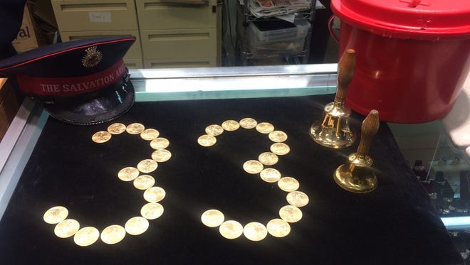 Thirty-three American Gold Eagle coins, each valued at $1,130, were placed in Salvation Army red kettles at five store locations in the Green Bay area Thursday, Dec. 22, 2016.