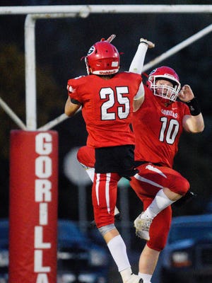 Gregory quarterback Andy McCance  (10) celebrates with wide receiver Blake Boes (25) after McCance scored a touchdown during the first half of their high school football game on Thursday, Oct. 19, 2017 in Gregory.