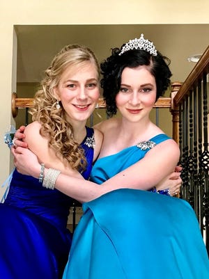 Summer Spicer, left, took her sister Leigh as her date to senior prom. Leigh was a freshman.