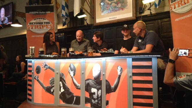 There was some talk at Beyond the Stripes, but the main attraction at Hofbrau Haus Tuesday was the Pop-a-Shot contest between Bengals quarterback Andy Dalton (left) and Xavier basketball coach Chris Mack (right). Mack won, 39-37.