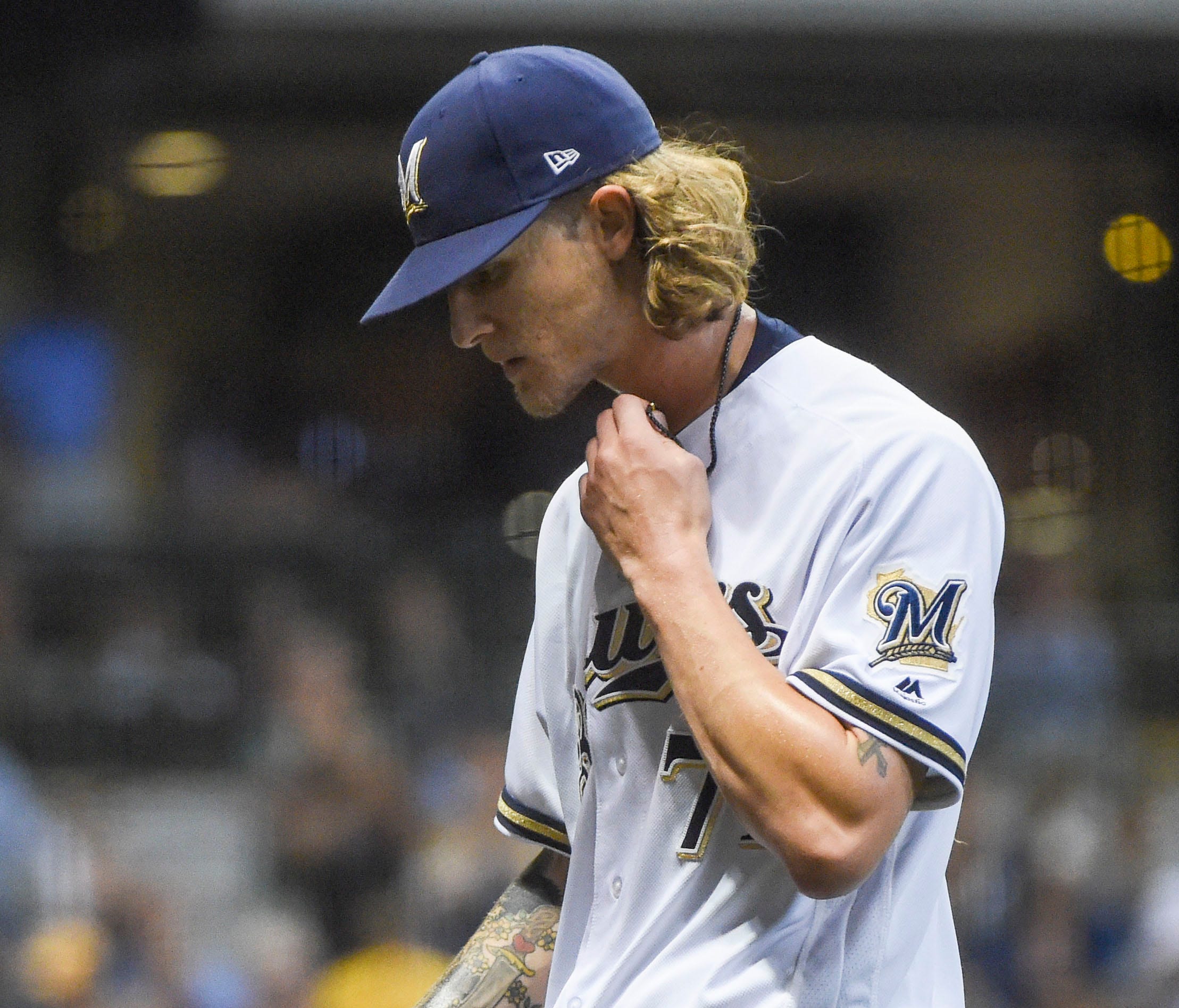 Milwaukee Brewers pitcher Josh Hader (71) walks back to the dugout after pitching the seventh inning against the Los Angeles Dodgers at Miller Park.