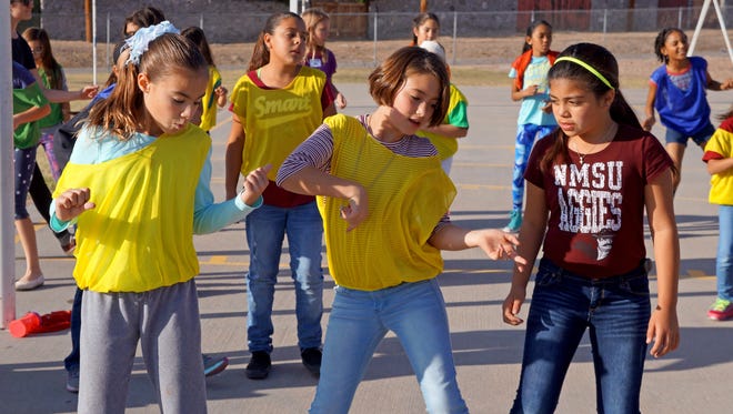 Students at Hillrise Elementary School in Las Cruces learn dance moves as part of the Aggie Play program, a research project by associate professors Phillip Post and Rebecca Palacios. Aggie Play is funded by the Paso del Norte Health Foundation to encourage physical activity among children between the ages of 6 and 15.