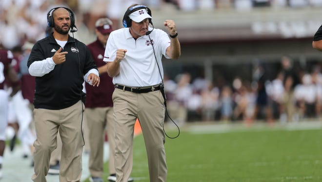 MSU head football coach Dan Mullen celebrates after Mississippi State's Nick Fitzgerald (7) scored on the first series of the game. Mississippi State played Charleston Southern in a college football game on Saturday, September 2, 2017 at Davis Wade Stadium in Starkville.