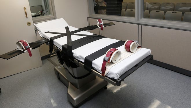 This Oct. 9, 2014, file photo shows the gurney in the execution chamber at the Oklahoma State Penitentiary in McAlester, Oklahoma. Supreme Court justices engaged in an impassioned debate today about capital punishment, trading unusually combative words in a case involving a drug used in several botched executions.